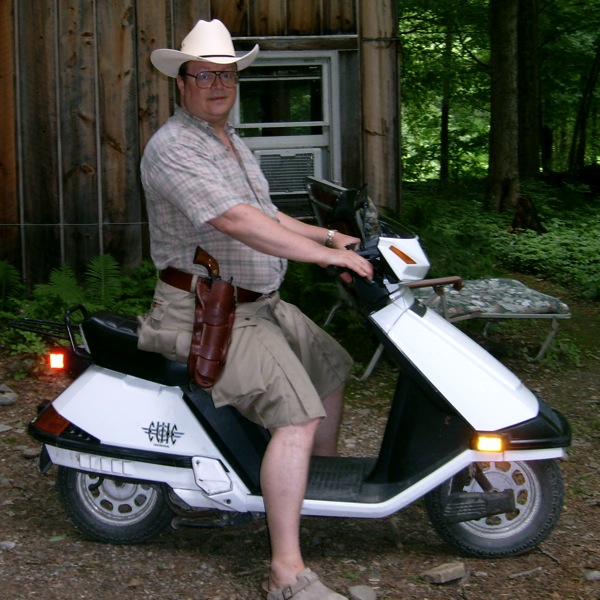 Sheriff Bill on his scooter wearing his kilt
